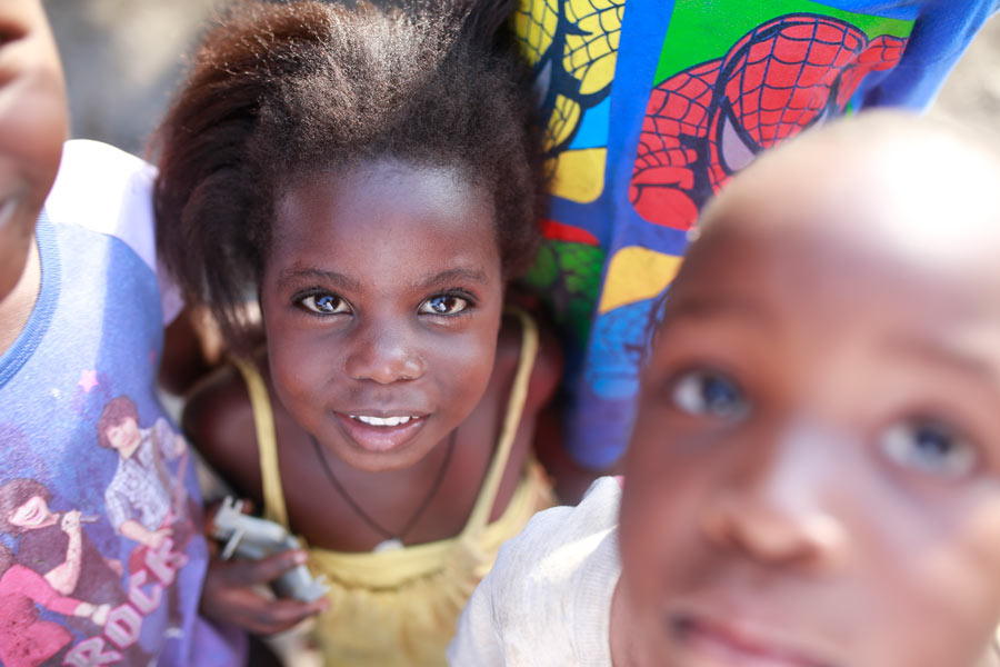 Children smiling looking into camera