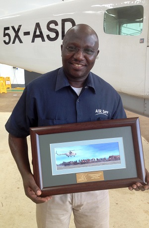 Paul Ogwang Holding WFP Award