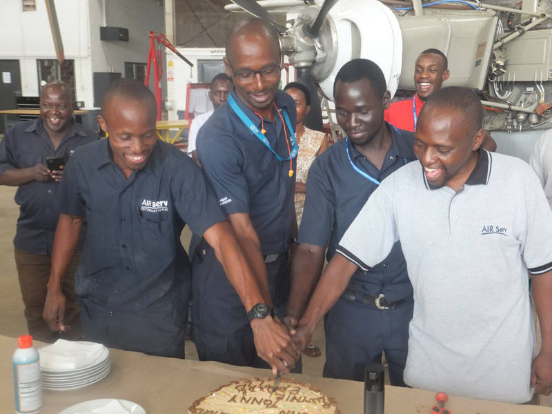 Air Serv engineering team cutting cake